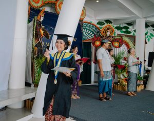 smiling female grad with certificate